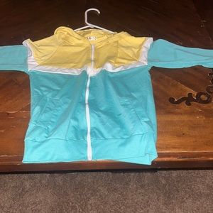 this jacket is yellow teal and white.